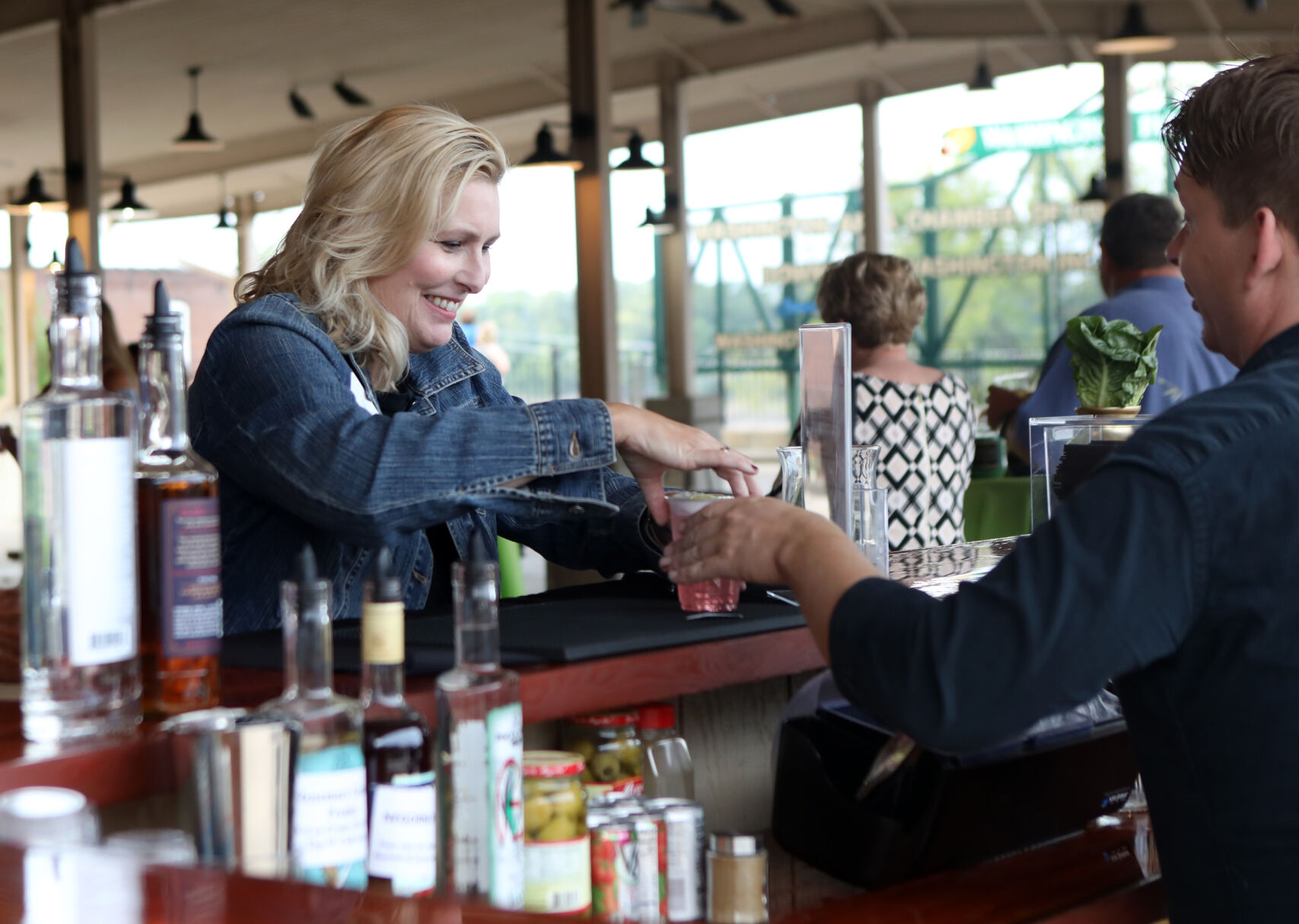 Tina Dulany receives her drink